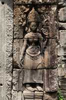 Statue of crowned woman on temple wall