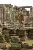 Statue on wall of ruined Bayon temple