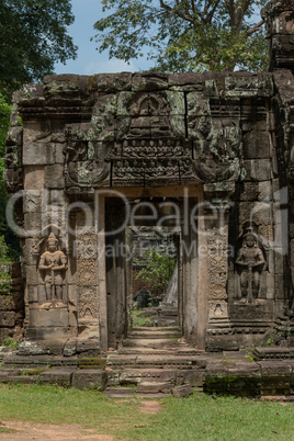 Statues in wall alcoves of temple entrance