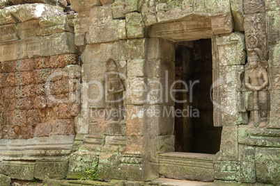 Stone doorway and bas-reliefs at ruined temple