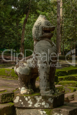 Stone lion guarding entrance to Ta Prohm