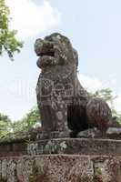 Stone lion on plinth guards East Mebon