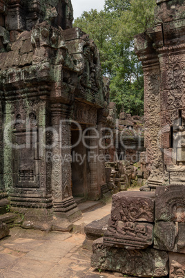 Stone portico opposite another building in temple