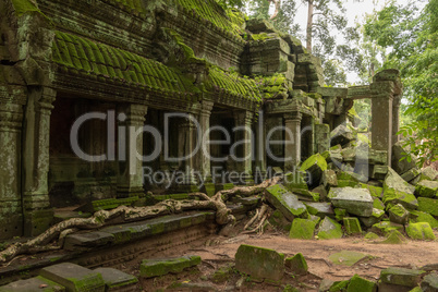 Temple colonnade and fallen rocks in jungle