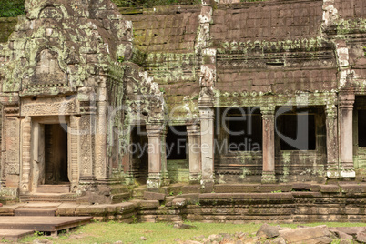 Temple colonnade covered with lichen by doorway