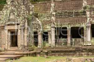 Temple colonnade covered with lichen by doorway