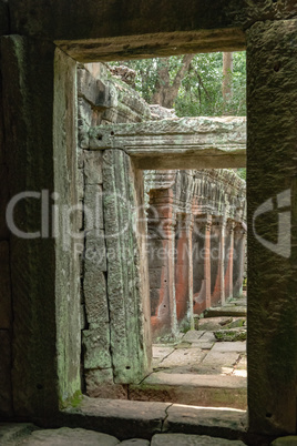 Temple colonnade framed by two stone doorways