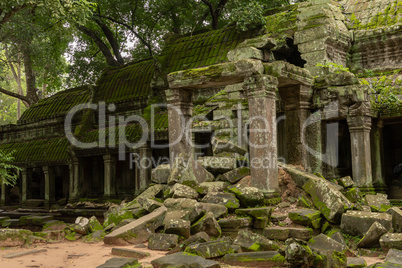 Temple colonnade with entrance blocked by rocks