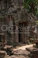 Temple doorway seen through gap in wall