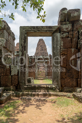Temple tower framed by ruined stone doorway