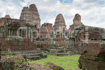 Towers of East Mebon behind stone wall