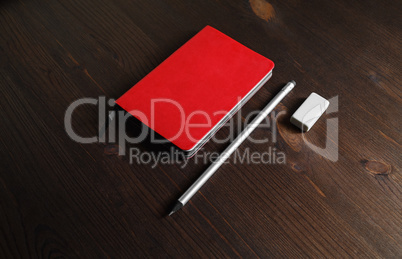 Red notebook, pencil, eraser