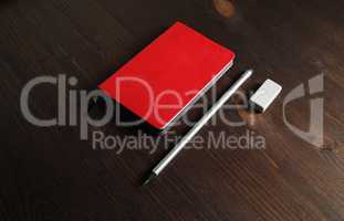 Red notebook, pencil, eraser