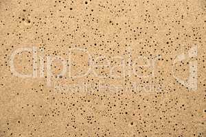 Sand of a beach with rain holes