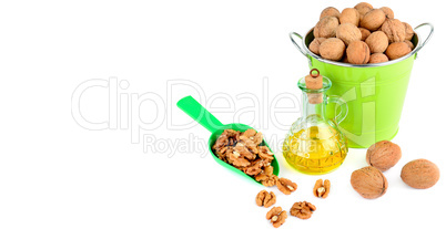 Oil of walnut and nut fruit isolated on white background. Wide p
