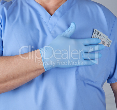 paper dollars in the doctor's pocket