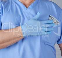 paper dollars in the doctor's pocket