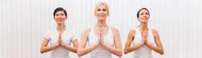 Panoramic Group of Three Beautiful Women Practising Yoga