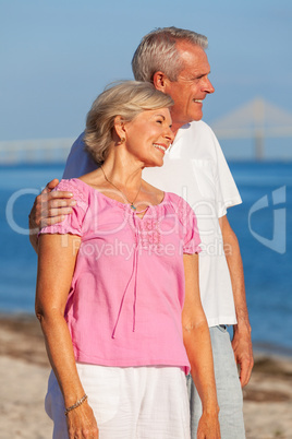 Happy Senior Couple Standing Embracing on a Beach