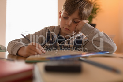 Boy doing his homework at home
