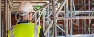 Rear View of a Construction Worker on Building Site