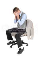 Business man sitting on chair with hands over face