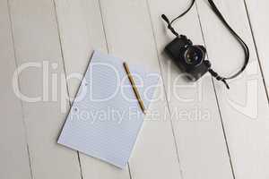 Notepad, pencil and camera