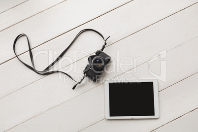 Digital tablet and camera on a surface Digital tablet and camera on a surface