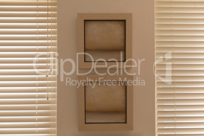 Wall frame near window blinds