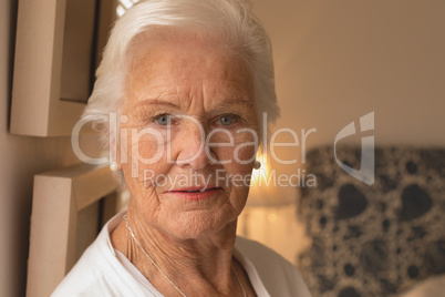 Senior woman relaxing in bedroom at home