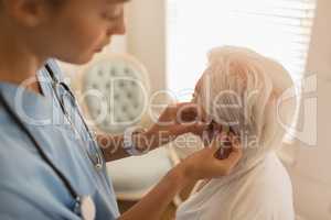 Female physician caring for senior woman