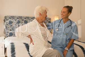 Senior woman interacting with female doctor