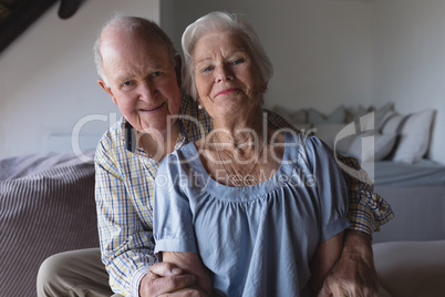 Senior couple sitting together in living room