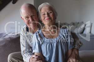 Senior couple sitting together in living room
