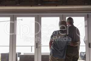 Senior couple standing together at home