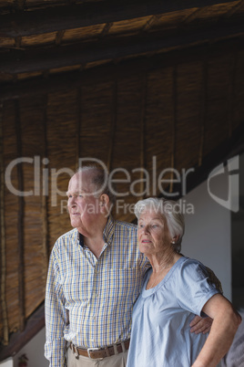 Senior couple standing together at home