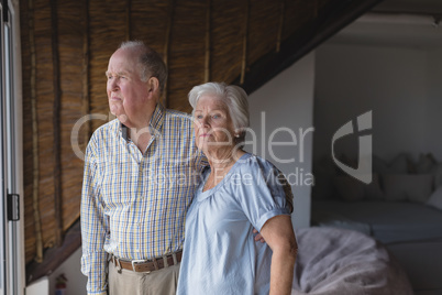 Senior couple standing together at home