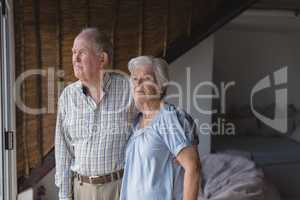 Senior couple standing together at home