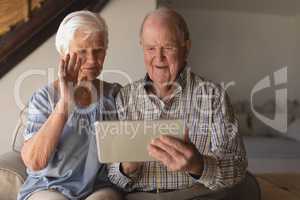 Senior couple using digital tablet