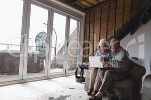 Senior couple using laptop