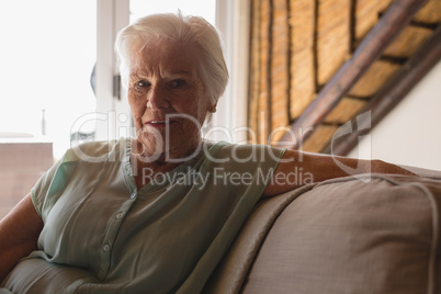 Senior woman relaxing in living room