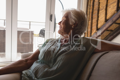 Senior woman relaxing in living room