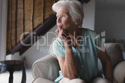 Senior woman relaxing in living room