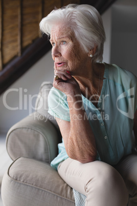 Senior woman relaxing in living room