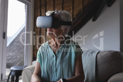 Senior woman using virtual reality headset