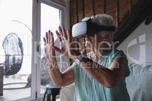 Senior woman using virtual reality headset