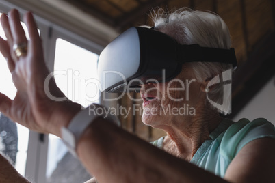 Senior woman using virtual reality headset