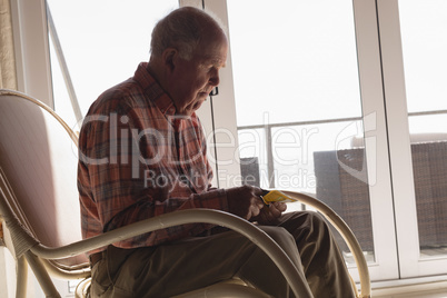 Senior man looking at medicine prescription