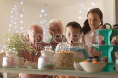 Multi-generation family celebrating birthday of grandson