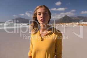 Young woman standing on the beach